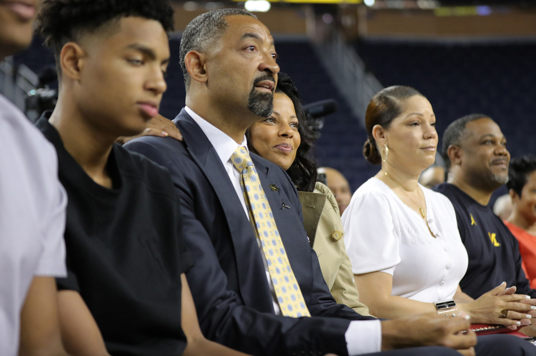 Juwan Howard sits with his wife Jenine as he waits to be introduced by University of Michigan Athletic Director Warde Manual as the new head basketball coach during a press conference on Thursday, May 30, 2019 at Crisler Center in Ann Arbor, Mich.
